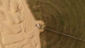 Aerial photo of circular green irrigation patches for agriculture in the desert. Dubai, UAE