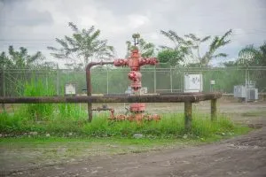 Abandoned old rusty oil rigs with preasure valve .