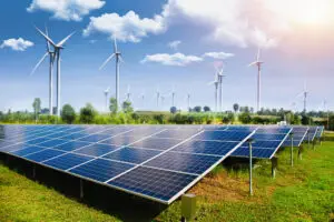 Solar panel with wind turbines