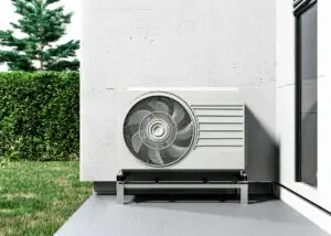 Close up on heat pump outside home