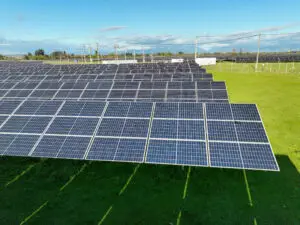 Aerial drone view of solar panels in a field