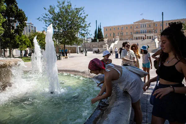 Tourists cooling off this week in Syntagma Square in Athens.