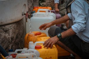 Taiz / Yemen - 13 Aug 2020 : Yemeni children fetch water due to the water crisis and the difficult living conditions