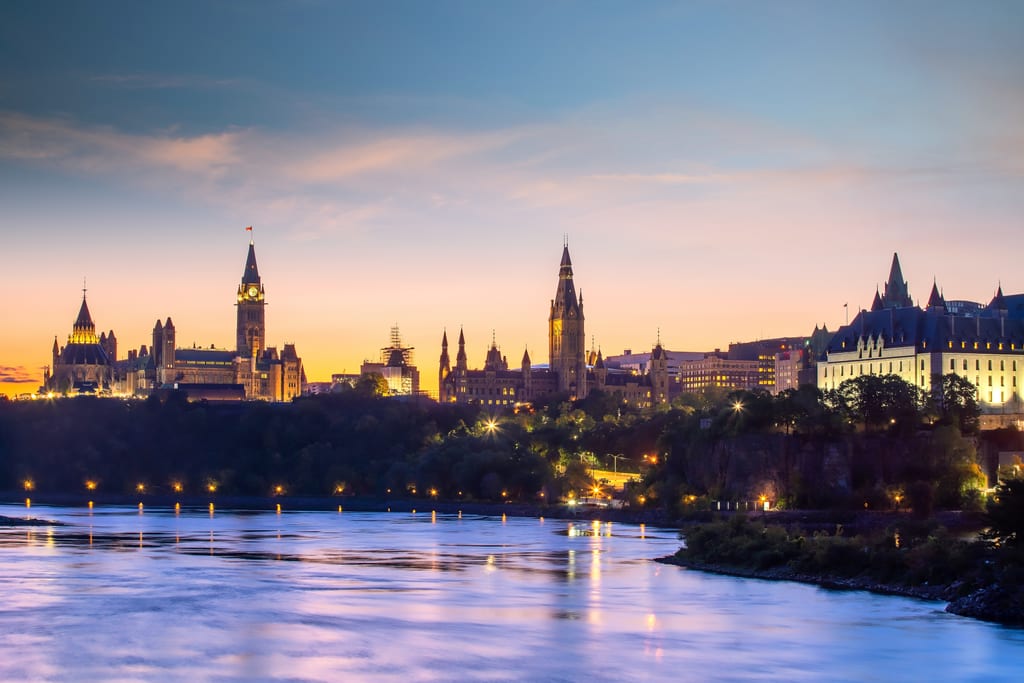 Parliament Hill and other federal government buildings in Ottawa, Ontario, Canada at Sunset