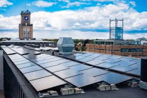 Installation of solar panels on a flat roof, in the center of Copenhagen.