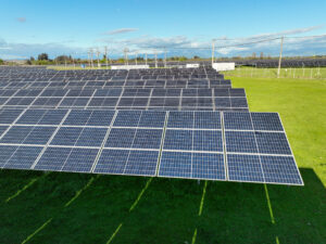 Aerial drone view of solar panels in a field
